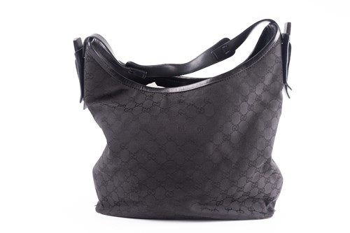 Lot 418 - A Gucci black leather and canvas handbag, a...