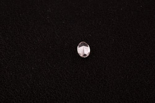 Lot 84 - A very pale light pink diamond, mixed oval-cut,...