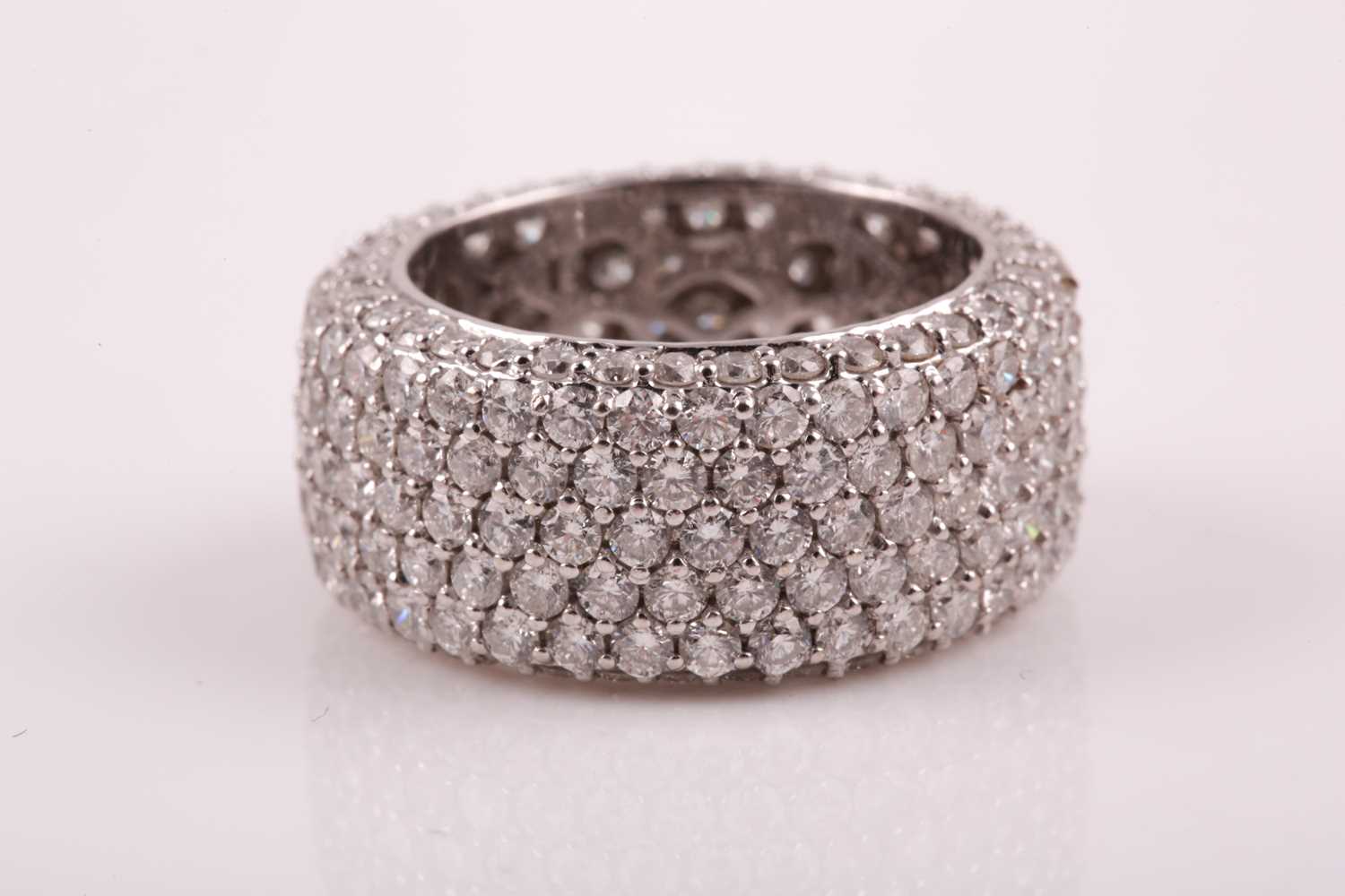 Lot 50 - An 18ct white gold and diamond eternity band...