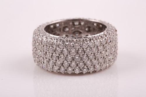 Lot 50 - An 18ct white gold and diamond eternity band...