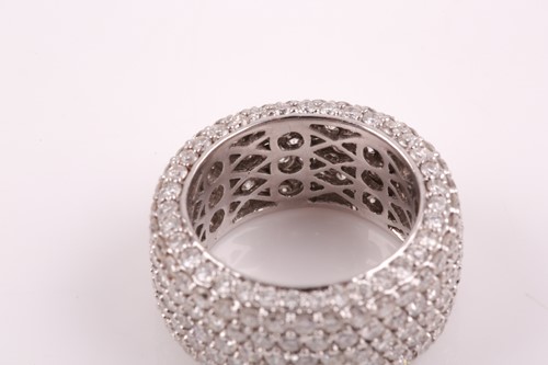 Lot 50 - An 18ct white gold and diamond eternity band...