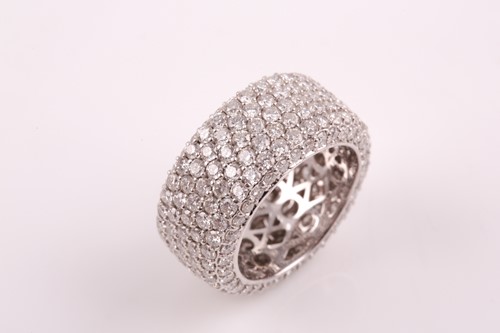 Lot 50 - An 18ct white gold and diamond eternity band...
