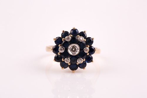 Lot 99 - A yellow metal, diamond, and sapphire roundel...