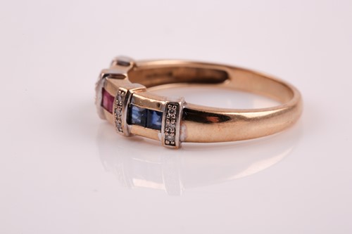 Lot 51 - A 9ct yellow gold, sapphire, ruby, and emerald...