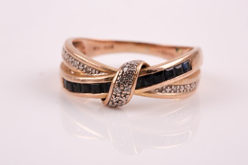 Lot 29 - A 9ct yellow gold, sapphire and diamond accent...