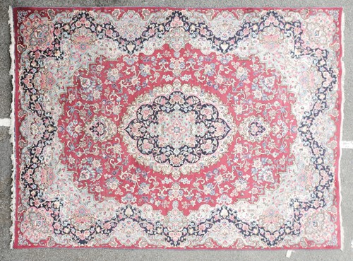 Lot 321 - A 20th crimson ground Kerman of book cover...