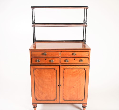 Lot 85 - A Regency ebonised and figured satinwood...