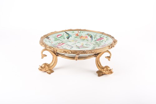 Lot 21 - A Chinese celadon glazed dish, painted with...