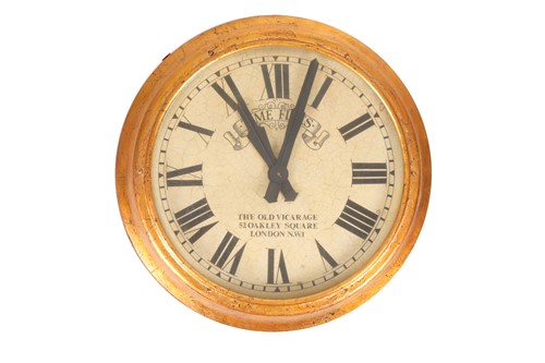 Lot 2 - A gilt-cased double-sided, circular, electric...