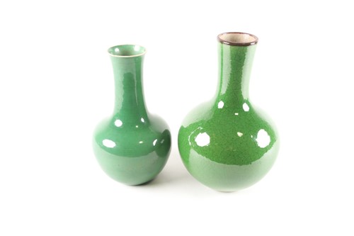Lot 31 - A Chinese pale green monochrome heavy globular...