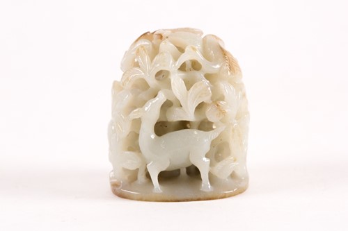 Lot 157 - A Chinese celadon and russet jade finial. Of...