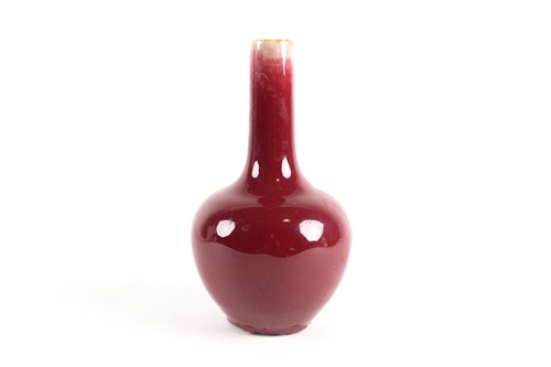 Lot 30 - A Chinese sang de boeuf vase, the rim with a...