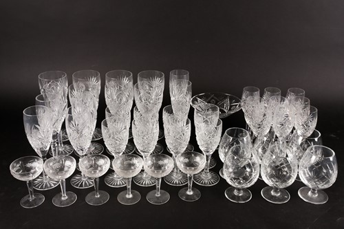 Lot 405 - A part suite of cut glass drinking glasses,...