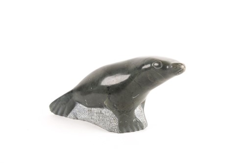 Lot 444 - An Inuit serpentine marble seal, 20th century,...