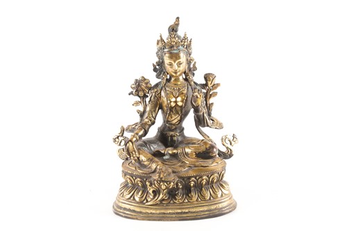 Lot 167 - A Sino Tibetan gilt-bronze figure of green...