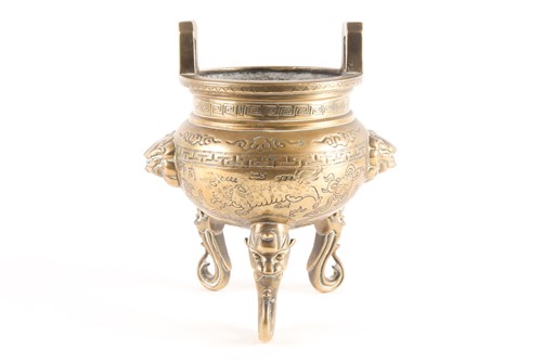 Lot 60 - A Chinese bronze two-handled tripod censer...