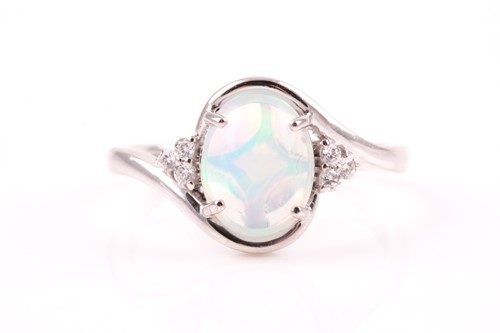 Lot 209 - A platinum, diamond, and Welo opal ring, the...