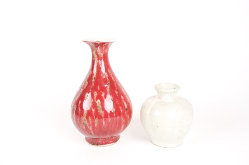 Lot 159 - A Chinese white glazed segmented globular vase,...