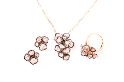 Lot 27 - An 18ct rose gold, sapphire and diamond...