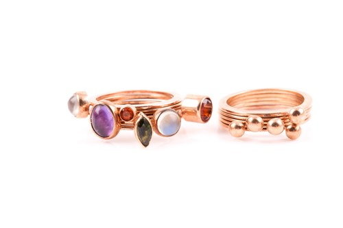 Lot 83 - A set of six yellow metal and gemstone rings,...