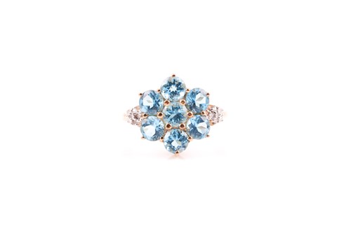 Lot 203 - A 9ct yellow gold and blue topaz floral...