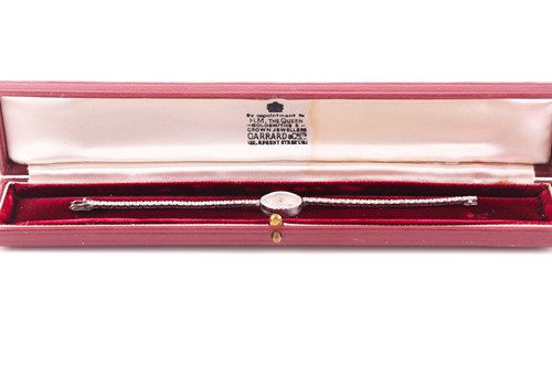Lot 524 - Girard Perregaux. A lady's diamond cocktail...