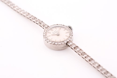 Lot 524 - Girard Perregaux. A lady's diamond cocktail...