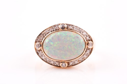Lot 136 - A 14ct yellow gold, diamond, and opal ring,...