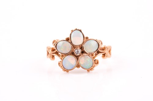 Lot 129 - A 9ct yellow gold and opal floral ring, set...