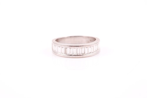 Lot 140 - An 18ct white gold and diamond half eternity...