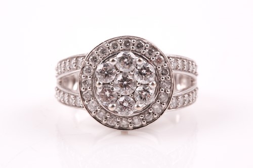 Lot 81 - A 14ct white gold and diamond cluster ring, by...