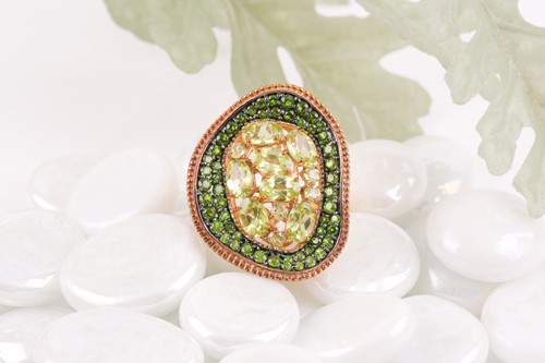Lot 74 - An unusual silver gilt, peridot, and green...