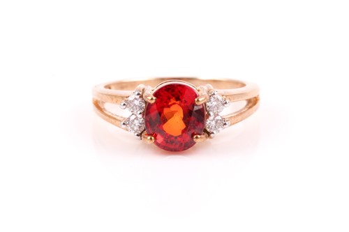 Lot 52 - A 9ct yellow gold, diamond, and orange...