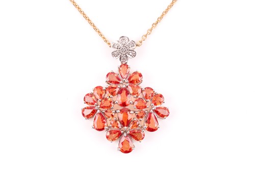 Lot 228 - A 9ct white gold and orange sapphire pendant,...