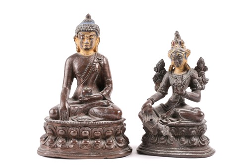 Lot 87 - A Tibetan patinated bronze figure of a Buddha...