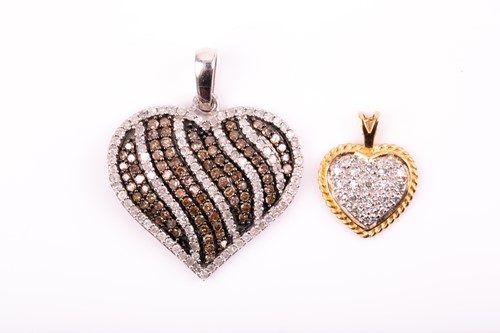 Lot 171 - A 9ct white gold pendant, inset with a swirled...