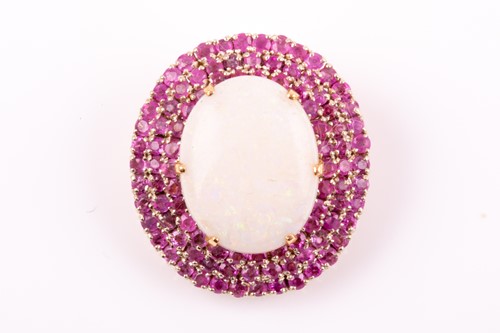 Lot 245 - A yellow gold, opal, and ruby pendant, set...