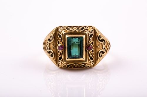 Lot 263 - A yellow metal and gemstone ring, set with a...