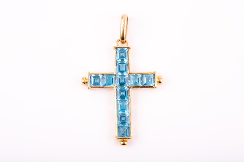 Lot 8 - An 18ct yellow gold and blue topaz cross...