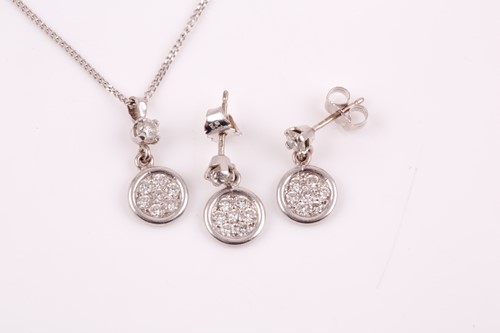 Lot 191 - An 18ct white gold and diamond pendant, the...