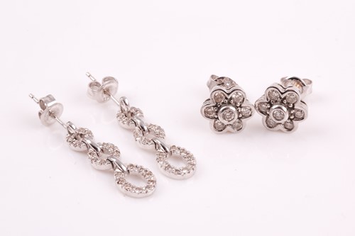 Lot 59 - A pair of 9ct white gold and diamond floral...