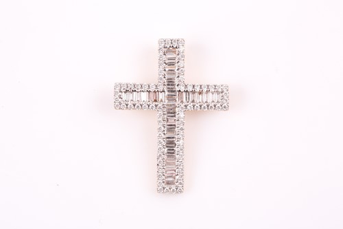 Lot 137 - An 18ct yellow gold and diamond cross pendant,...