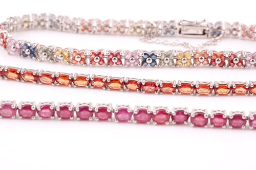 Lot 92 - A silver and ruby line bracelet, together with...