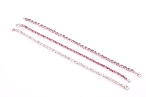 Lot 123 - A silver and amethyst line bracelet, together...