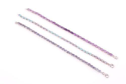 Lot 125 - A silver, teal apatite, and tanzanite line...