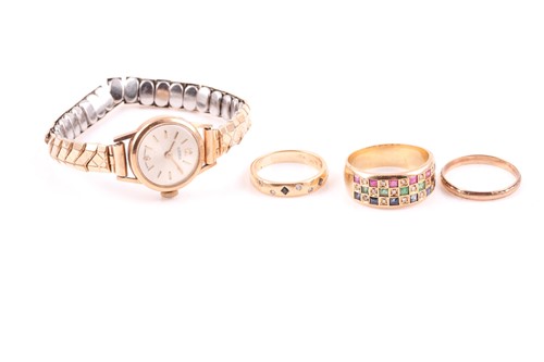 Lot 22 - A yellow metal, emerald, sapphire, and ruby...