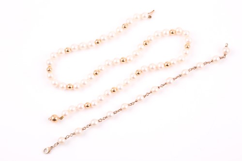 Lot 28 - An 18ct yellow gold and cultured pearl...