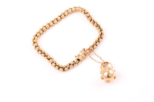 Lot 197 - A yellow metal cannetille bracelet, comprised...