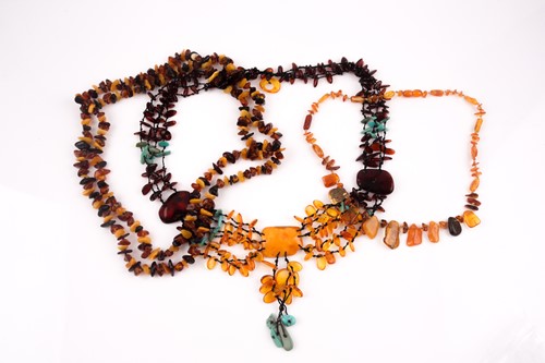 Lot 96 - An opera-length multi-coloured amber necklace,...