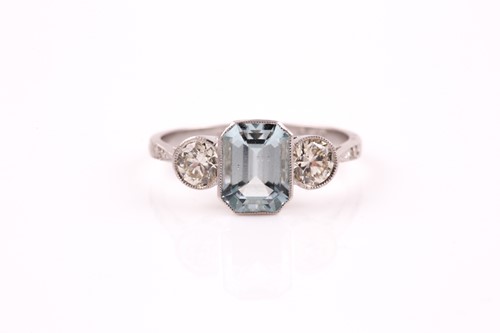 Lot 220 - A diamond, aquamarine, and platinum ring, set...